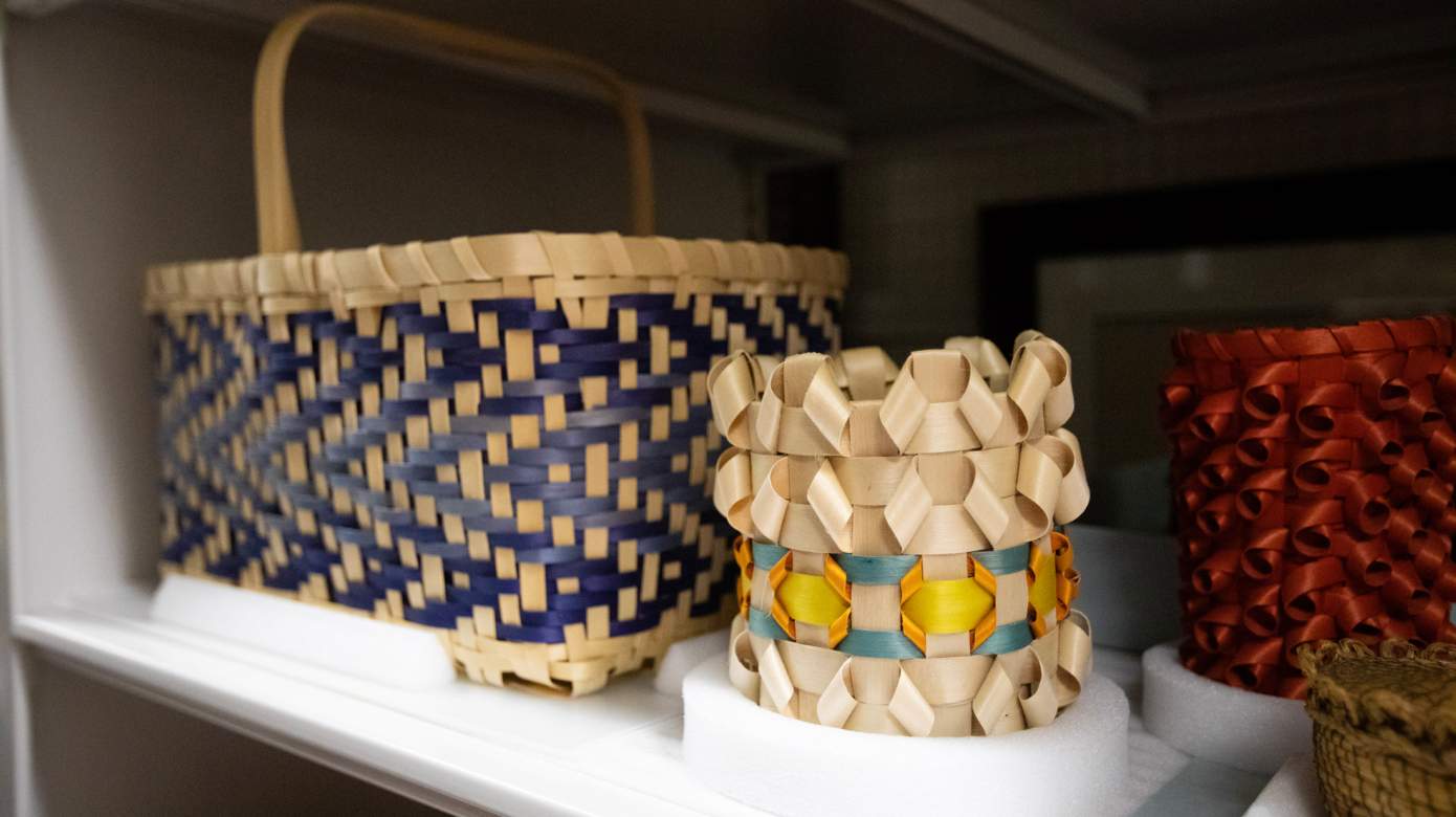 Two woven baskets carefully stored in the Cultural Heritage Center archives.