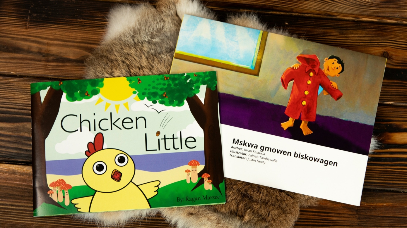 A flat lay of two books produced by the CPN Language Department - Chicken Little and Mskwa gmowen biskowagen.