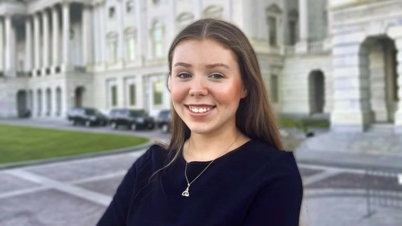 Headshot of CPN tribal member Katie Lynch in front of a large white stone building with columns and a dome.