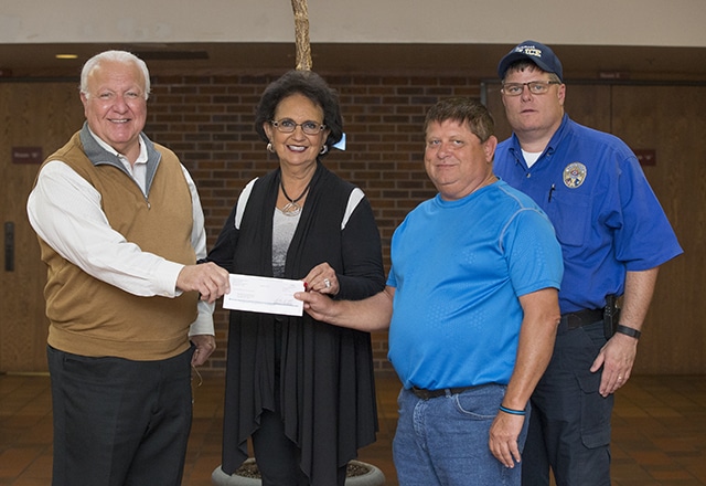 CPN Tribal Chairman John Rocky Barrett and CPN Vice Chairman Linda Capps donate the final $5,000 for the active shooter kits to Tecumseh City Manager Jimmy Stokes and Tecumseh P.D.'s J.R. Kidney. 
