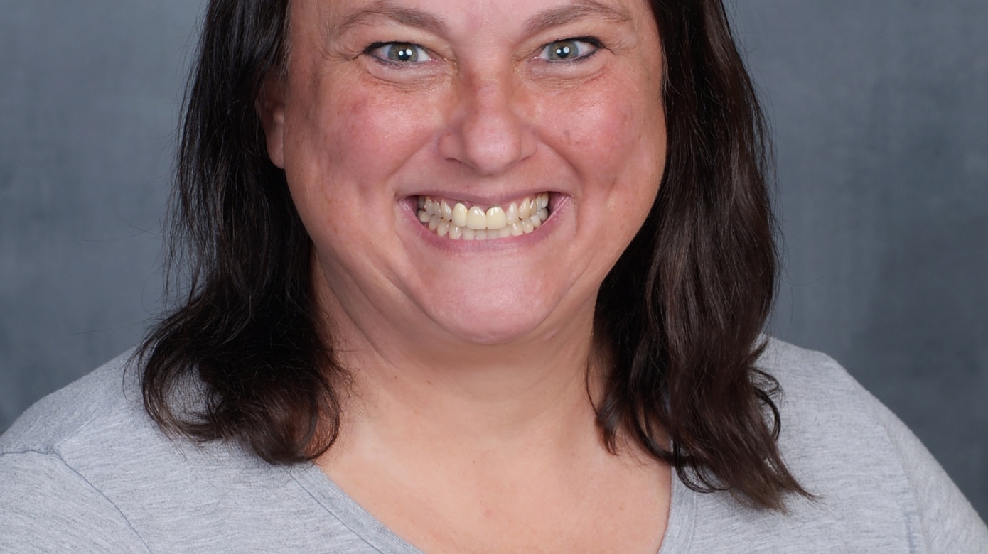 A head shot of CPN Tribal member and 2022 Oklahoma Teacher of the Year finalist Kortni Torralba. Her smile lights up her entire face, and her brown hair falls to her shoulders.