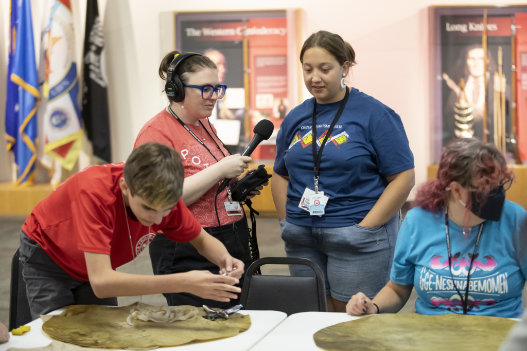 Hownikan Podcast host Paige Willett interviews participants at a Cultural Heritage Center class during the 2022 Family Reunion Festival.