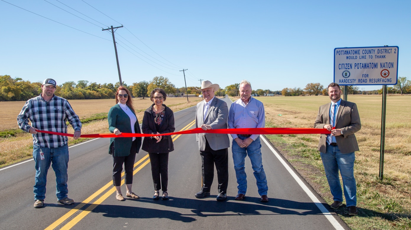 CPN Roads Manager Clint Mascho, CPN Transportation Director Shawn Howard, CPN Vice-Chairman Linda Capps, CPN Chairman John “Rocky” Barrett, County Commissioner Randy Thomas and Circuit Engineering’s Daniel Clements gather for the ribbon cutting ceremony to open Hardesty Road.