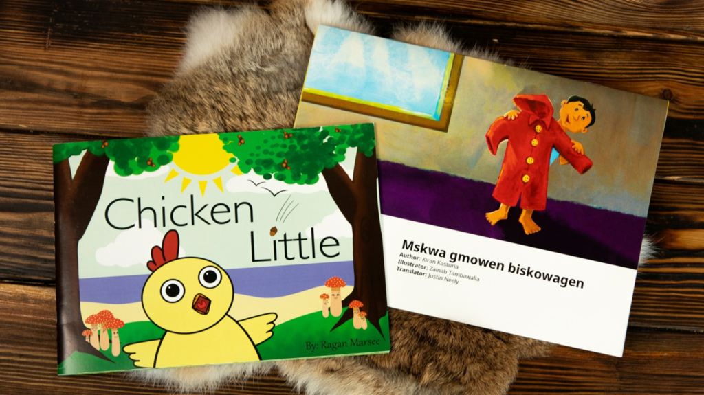 Flat lay of two books from the CPN Language Department: Chicken Little and Mskwa gmowen biskowagen.