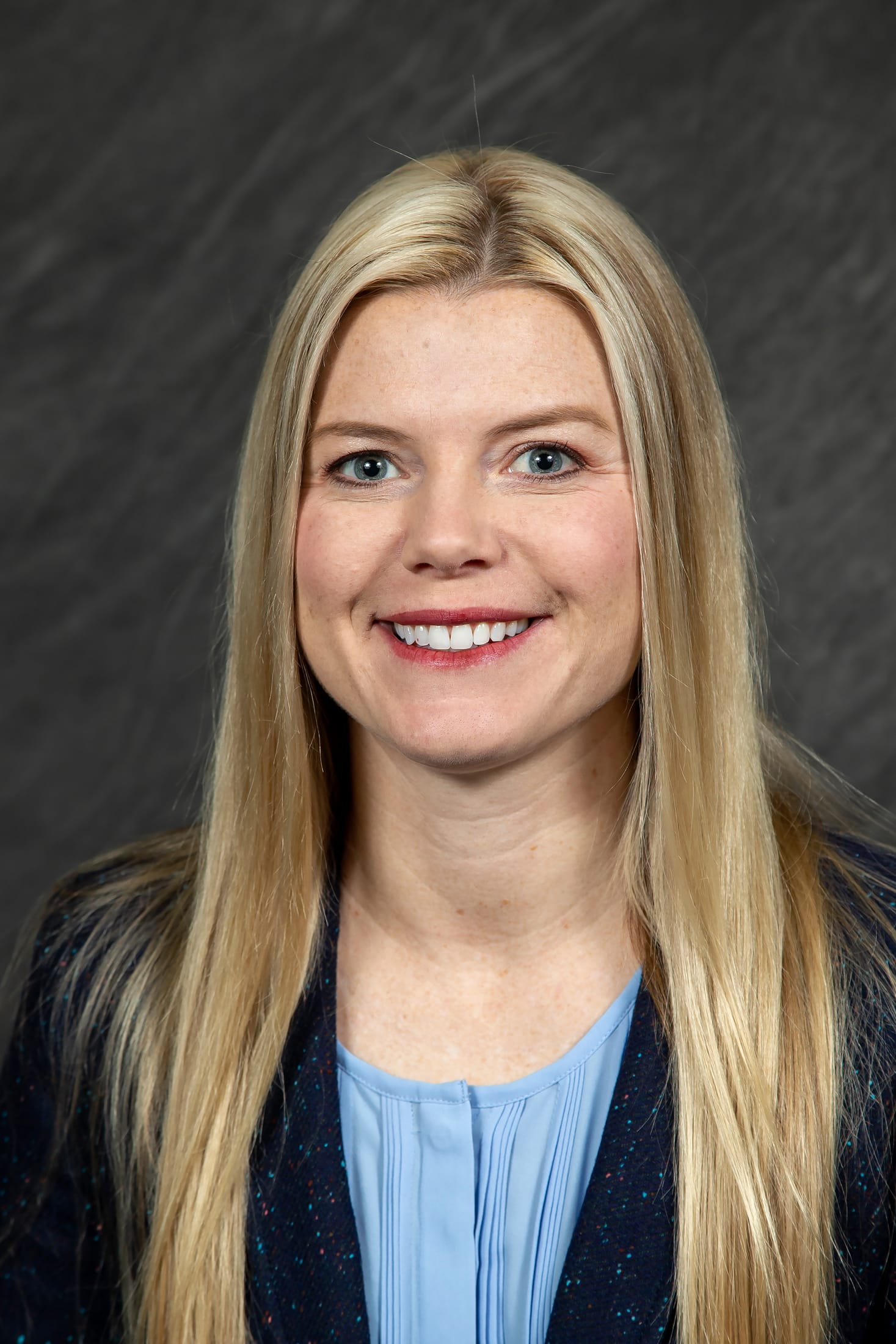 Headshot of CPN Health Services' Dr. Kassi Sexton. She has long blonde hair, blue eyes and wears a light blue blouse.
